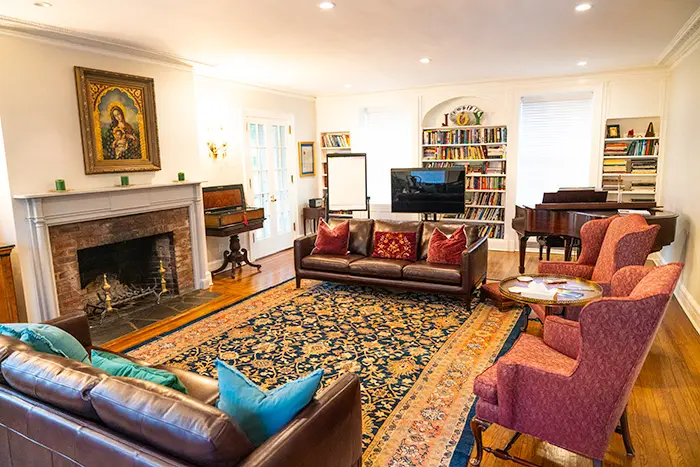 Living room with fireplace and comfortable looking leather couches
